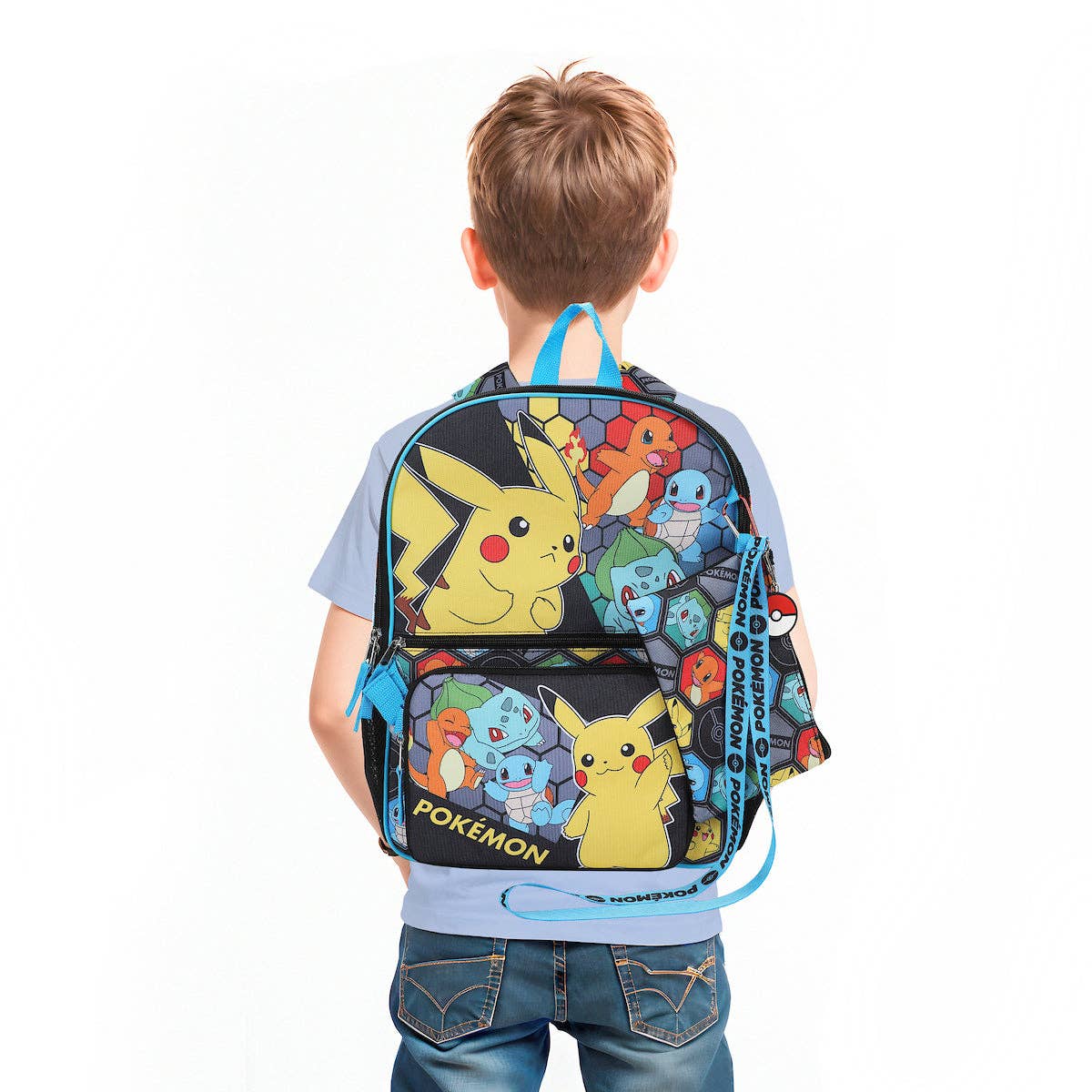 Child wearing a colorful backpack with cartoon characters on a white background