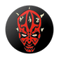 Circular design with a red and black face on a black background