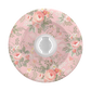 A round plastic bottle cap featuring a vintage-style floral pattern in pink, green, and white, with a clear plastic insert in the center.
