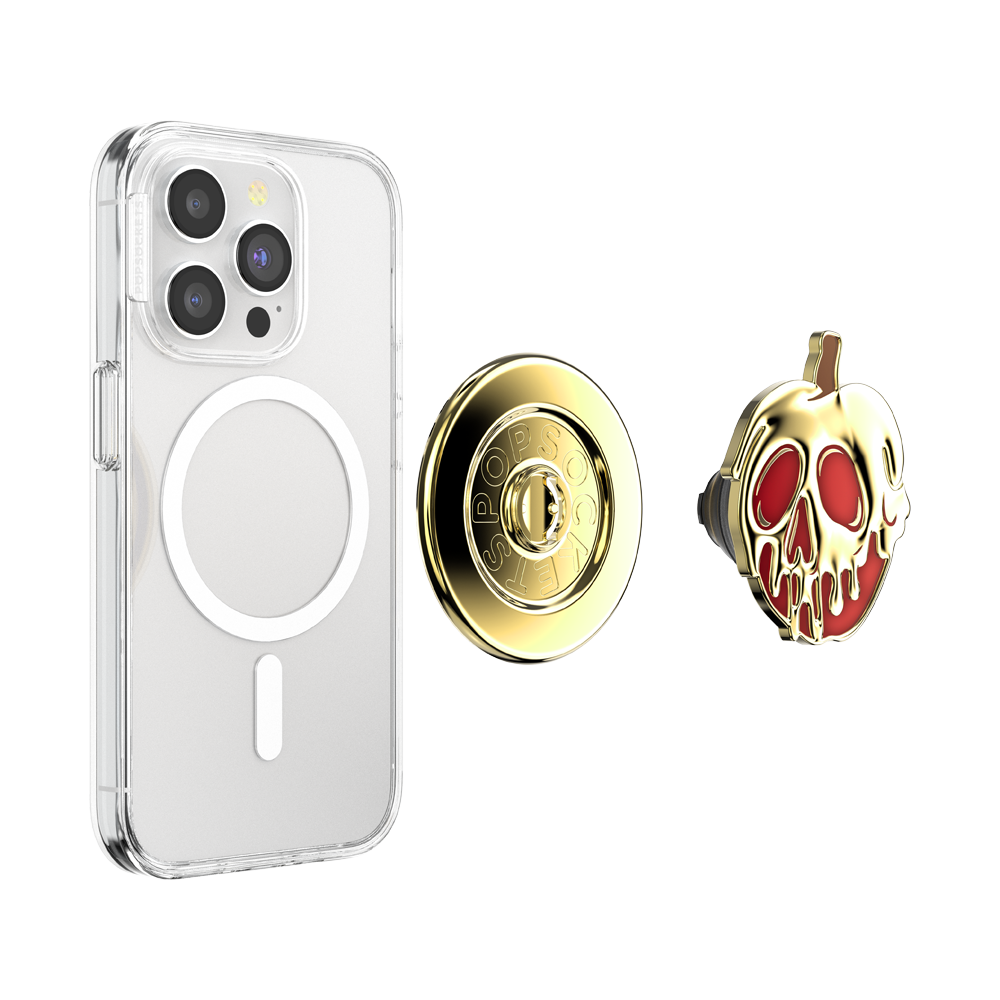 A clear protective phone case with a MagSafe ring, shown alongside a gold circular magnetic mount and a gold-and-red skull-shaped accessory on a plain white background.