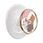 A PopSicle phone grip featuring a circular cartoon illustration of three cats (Marie, Olympe, and Thérèse) on a white and pink striped background, framed by a rose gold metallic border. The back of the grip is translucent white with the brand name 'POPSICLE' embossed.
