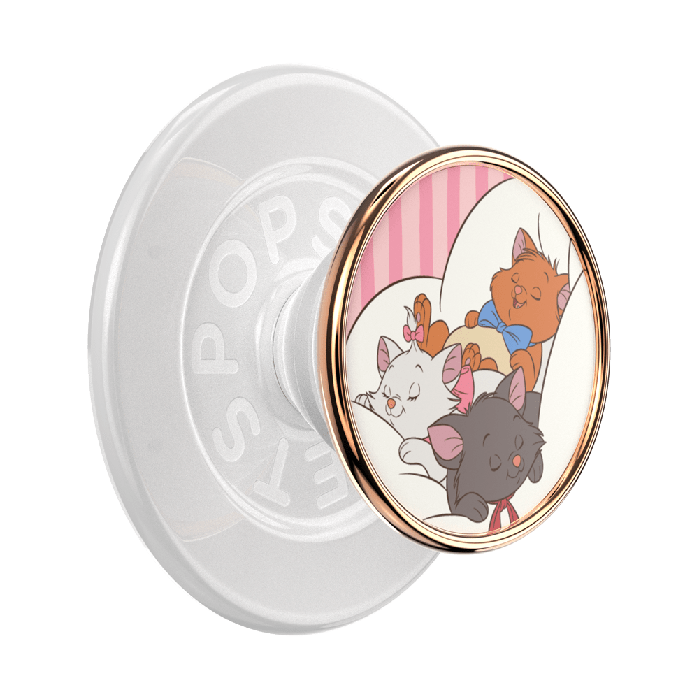 A PopSicle phone grip featuring a circular cartoon illustration of three cats (Marie, Olympe, and Thérèse) on a white and pink striped background, framed by a rose gold metallic border. The back of the grip is translucent white with the brand name 'POPSICLE' embossed.