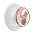 A PopSicle phone grip featuring a circular cartoon illustration of three cats (Marie, Olympe, and Thérèse) on a white and pink striped background, framed by a rose gold metallic border. The back of the grip is translucent white with the brand name &