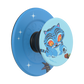 A blue PopSockets phone grip with a cartoon tiger character printed on the flip-up top. The grip features a blue textured base with white star accents and a light blue flip-up section displaying a blue tiger with orange eyes.