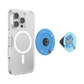 A clear MagSafe-compatible phone case shown on a smartphone, alongside two round pop socket grips: one blue with white star graphics and one light blue featuring a cartoon cat character.