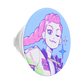 An oval-shaped pop socket featuring a stylized graphic illustration of a winking girl with pink hair, set against a light blue background.