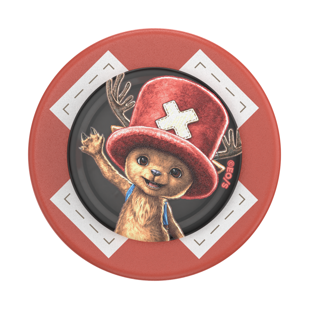 Round red object with a bear wearing a red hat and blue scarf on a white background