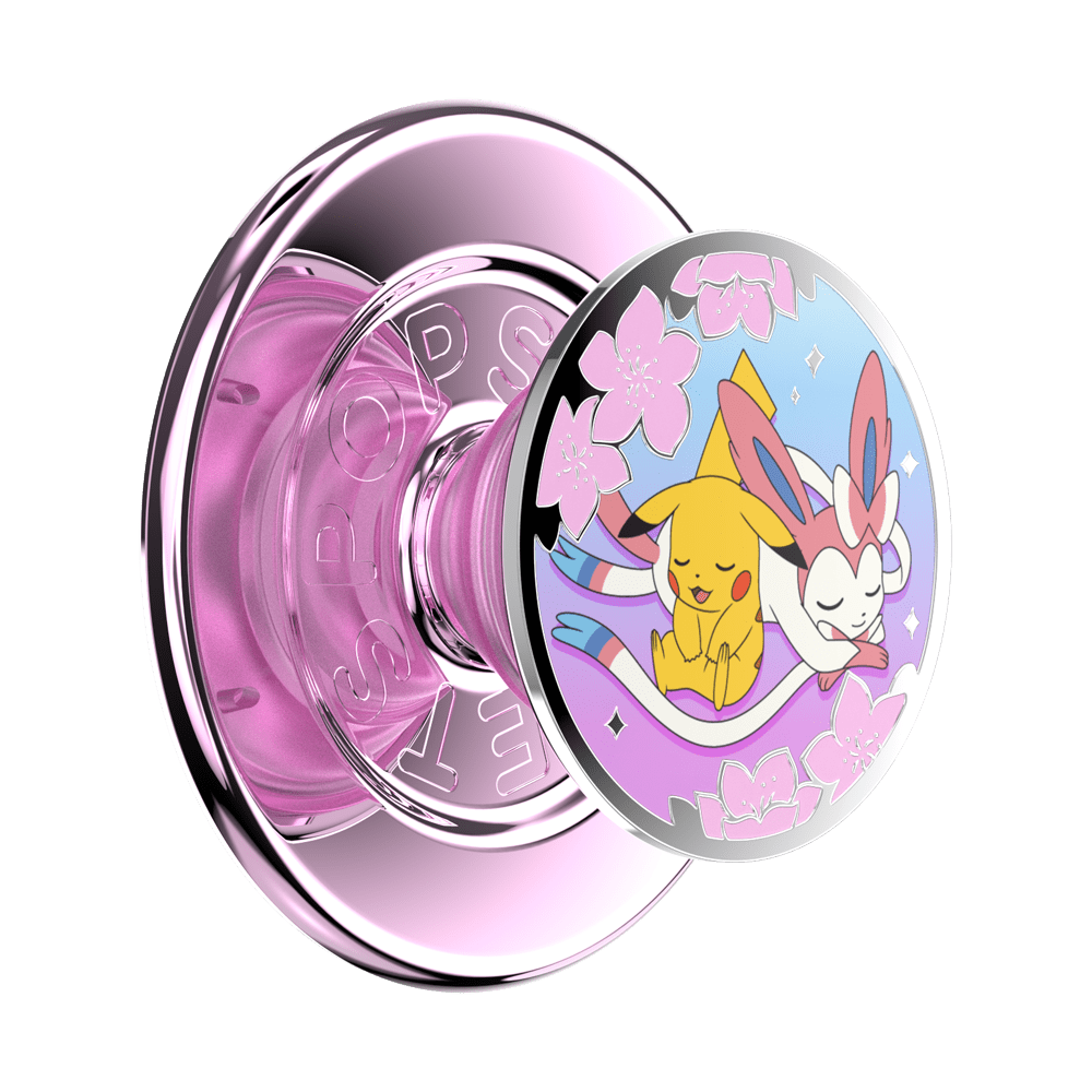 A pink and silver PopSock phone grip with a circular clear cover featuring an illustration of Pikachu and Eevee under pink cherry blossoms.