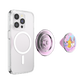 A clear MagSafe-compatible phone case shown on a smartphone, with two detachable circular pop sockets displayed beside it: one metallic pink and one pink with a colorful cartoon character design.