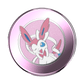 Circular compact popsocket with a cartoon character on a pink background