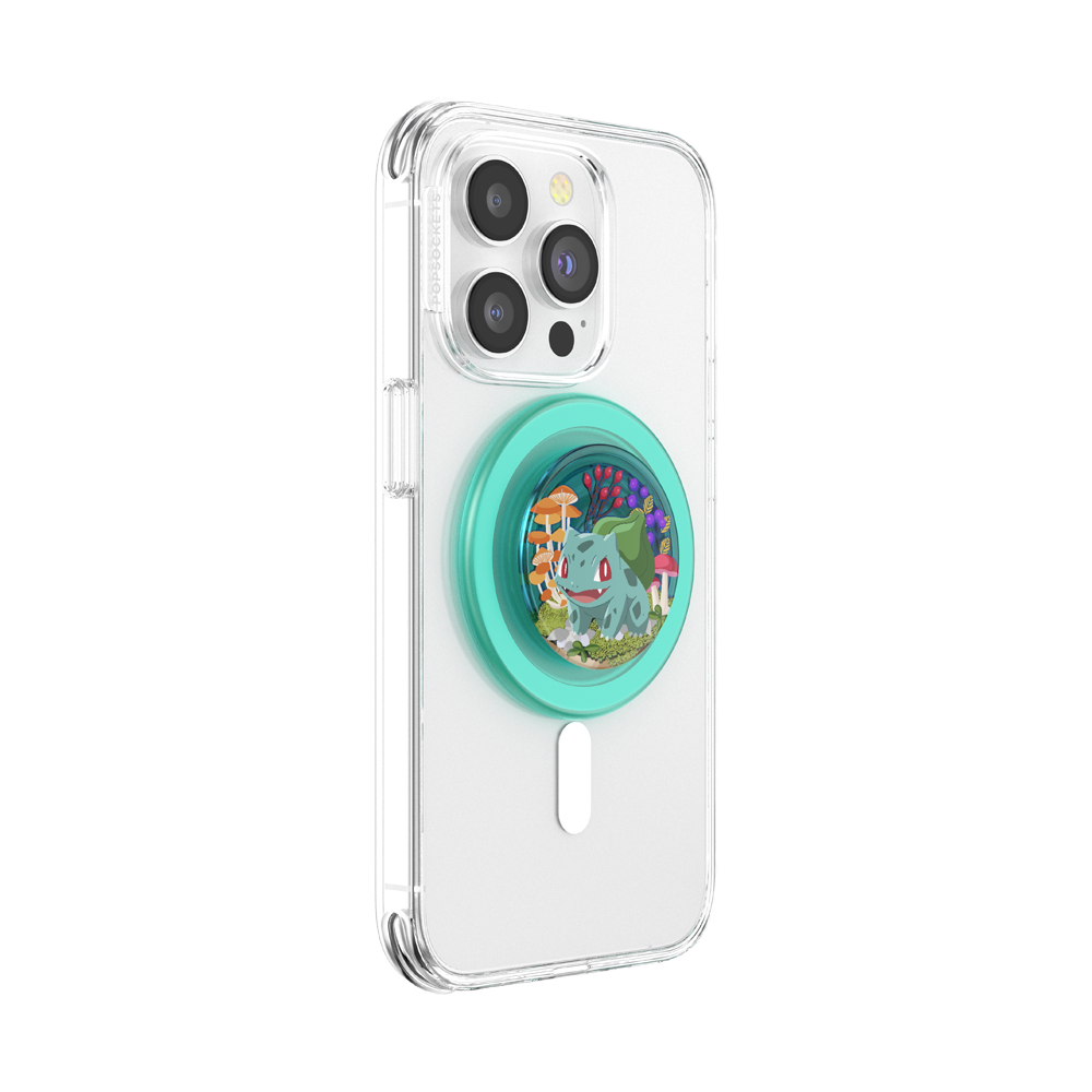 A clear protective phone case for an iPhone, featuring a mint green PopSocket-style grip on the back with a colorful illustration of Bulbasaur.