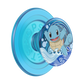 A light blue PopSockets phone grip featuring a circular design of the Pokémon character Squirtle surrounded by blue waves and white foam, shown on a plain white background.