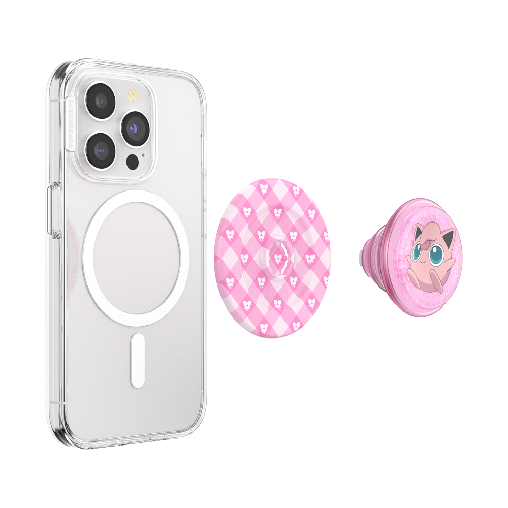 A clear phone case shown on a smartphone, accompanied by two pink pop socket-style accessories: one with a pink argyle pattern and heart motifs, and one with a pink cartoon character design.