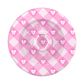A round pink and white checkered float with a repeating bow pattern, shown from a top-down view on a white background.