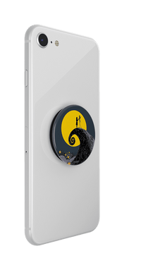 Phone case with a popsocket featuring a design of a character climbing a moonlit tree on a clear night.