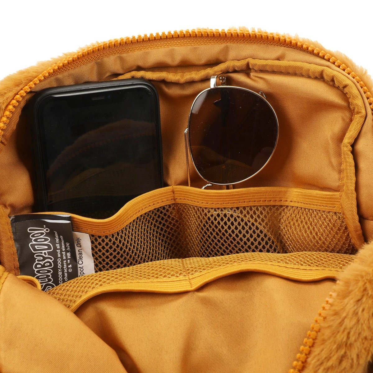 Yellow pouch with phone, sunglasses, and a small item inside