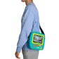 Person wearing a blue sweatshirt with a turquoise bag featuring 'Scooby-Doo' text.