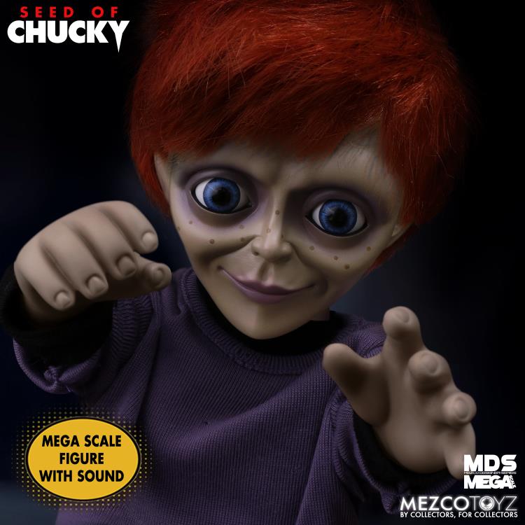 Mega scale figure of a character with red hair and blue eyes, wearing a purple shirt, on a dark background with 'Seed of Chucky' branding.