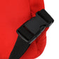 Close-up of a red bag with a black strap and buckle on a white background