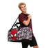 Person holding a Spider-Man duffel bag on a white background