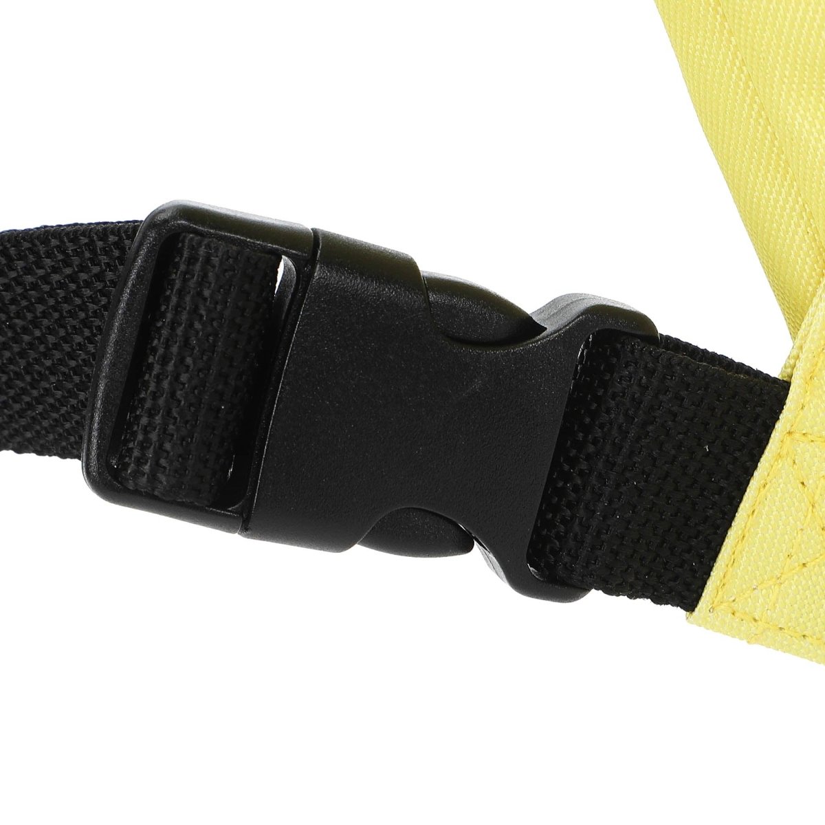 Close-up of a black belt buckle on a yellow background