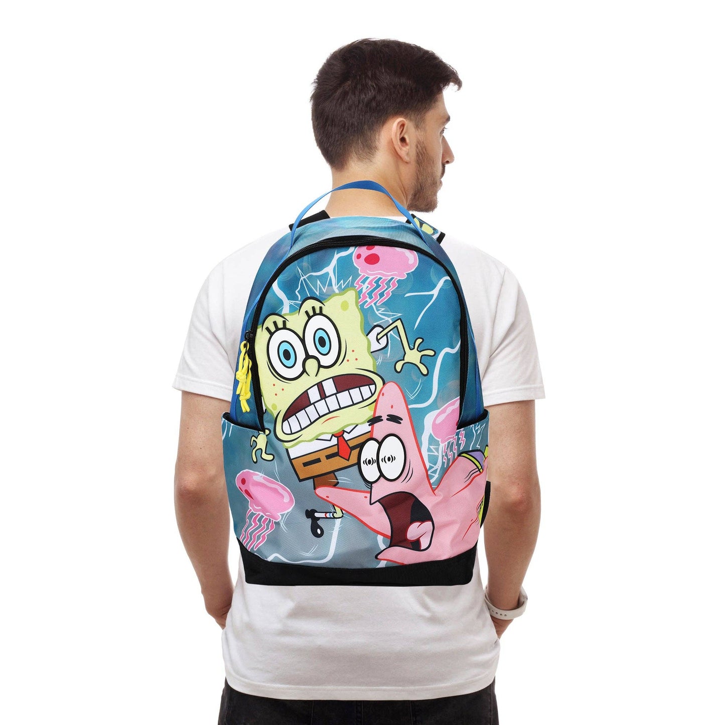 Person wearing a colorful backpack with cartoon characters on a white background