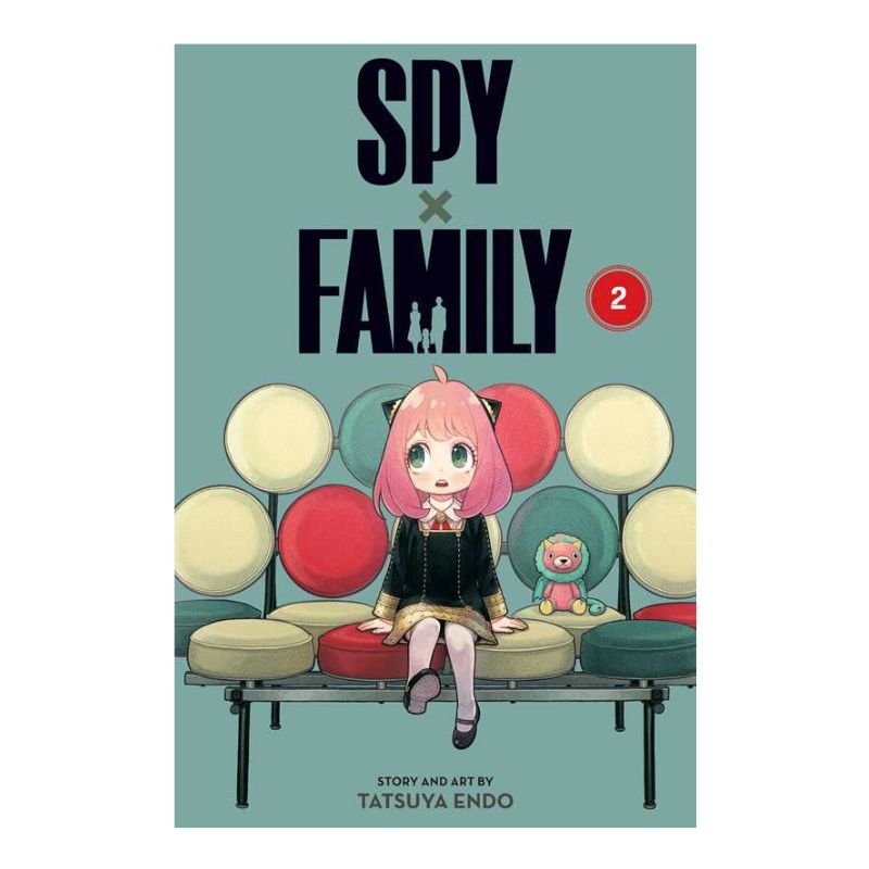 Front cover of the manga book 'SPY x FAMILY Volume 2' by Tatsuya Endo, featuring an illustration of a pink-haired girl sitting on a bench with colorful round cushions against a muted teal background.