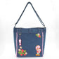 Strawberry Shortcake denim tote bag with scalloped edges and vintage-inspired artwork