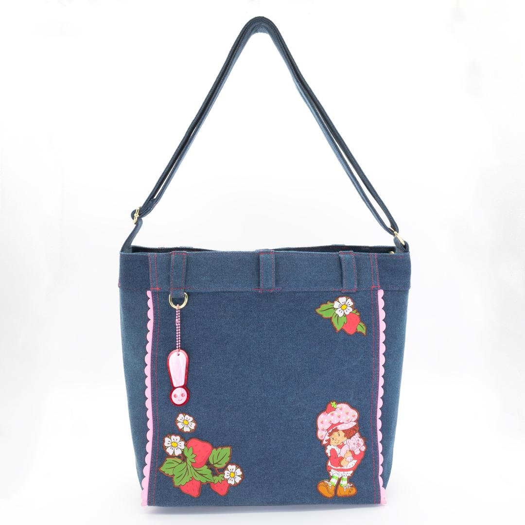 Strawberry Shortcake denim tote bag with scalloped edges and vintage-inspired artwork