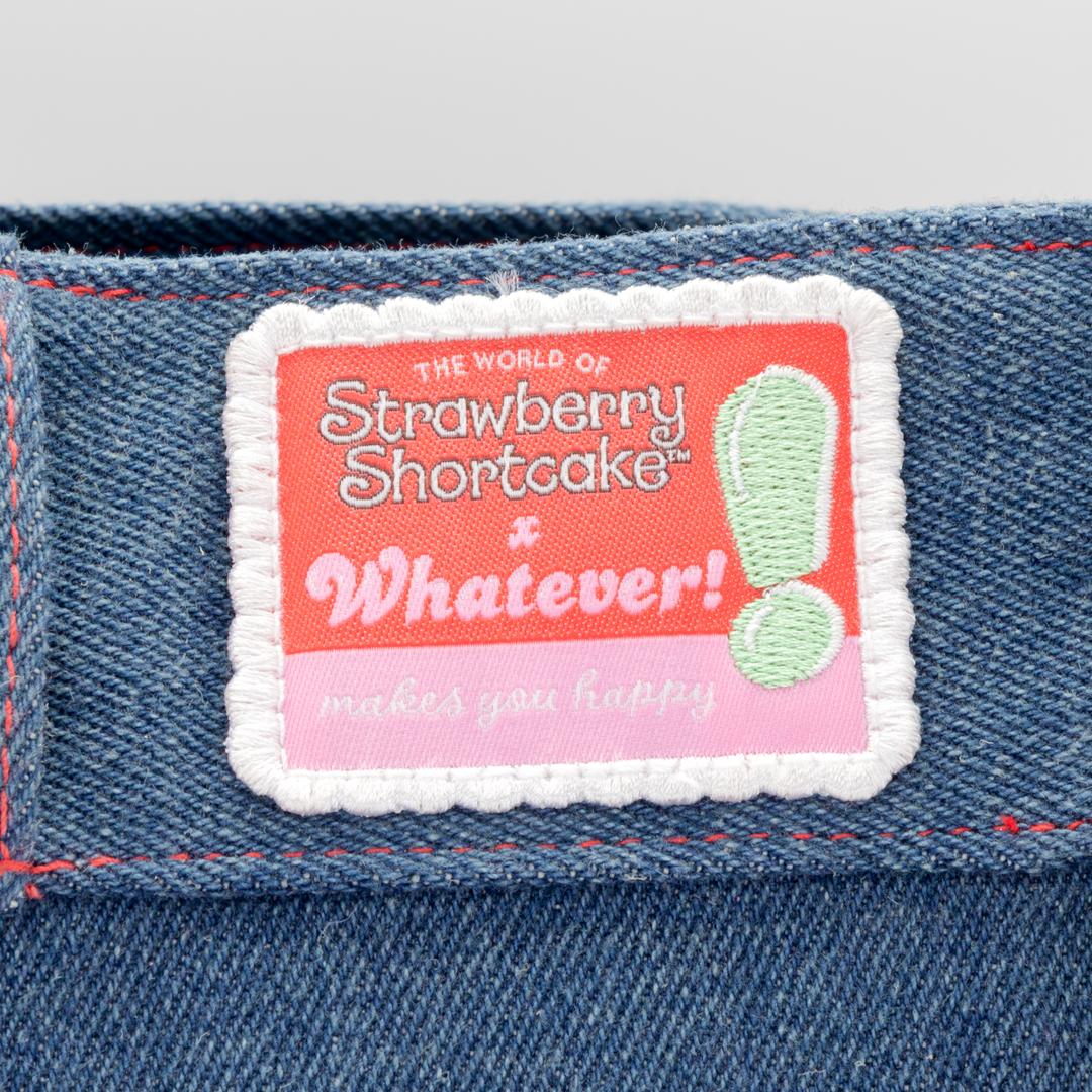 Denim tote bag decorated with Strawberry Shortcake and floral details from the classic Strawberryland design