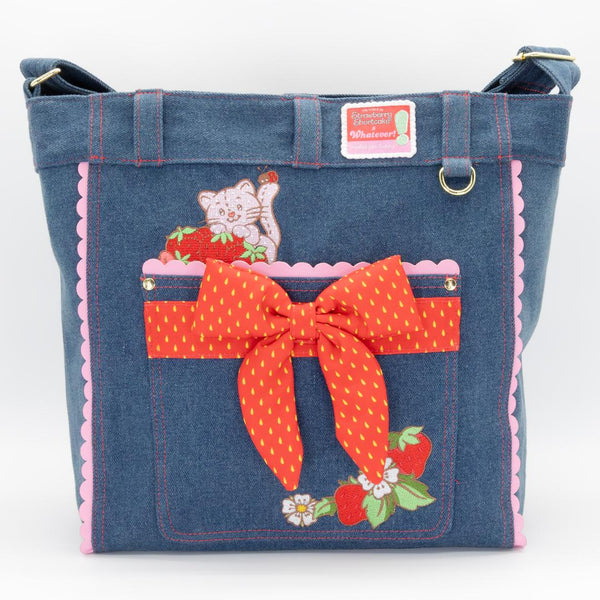 Front view of the Whatever Makes You Happy Strawberry Shortcake denim tote featuring 1980s-style character art