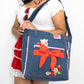 Vintage Strawberry Shortcake artwork on a denim tote with playful scallop edging