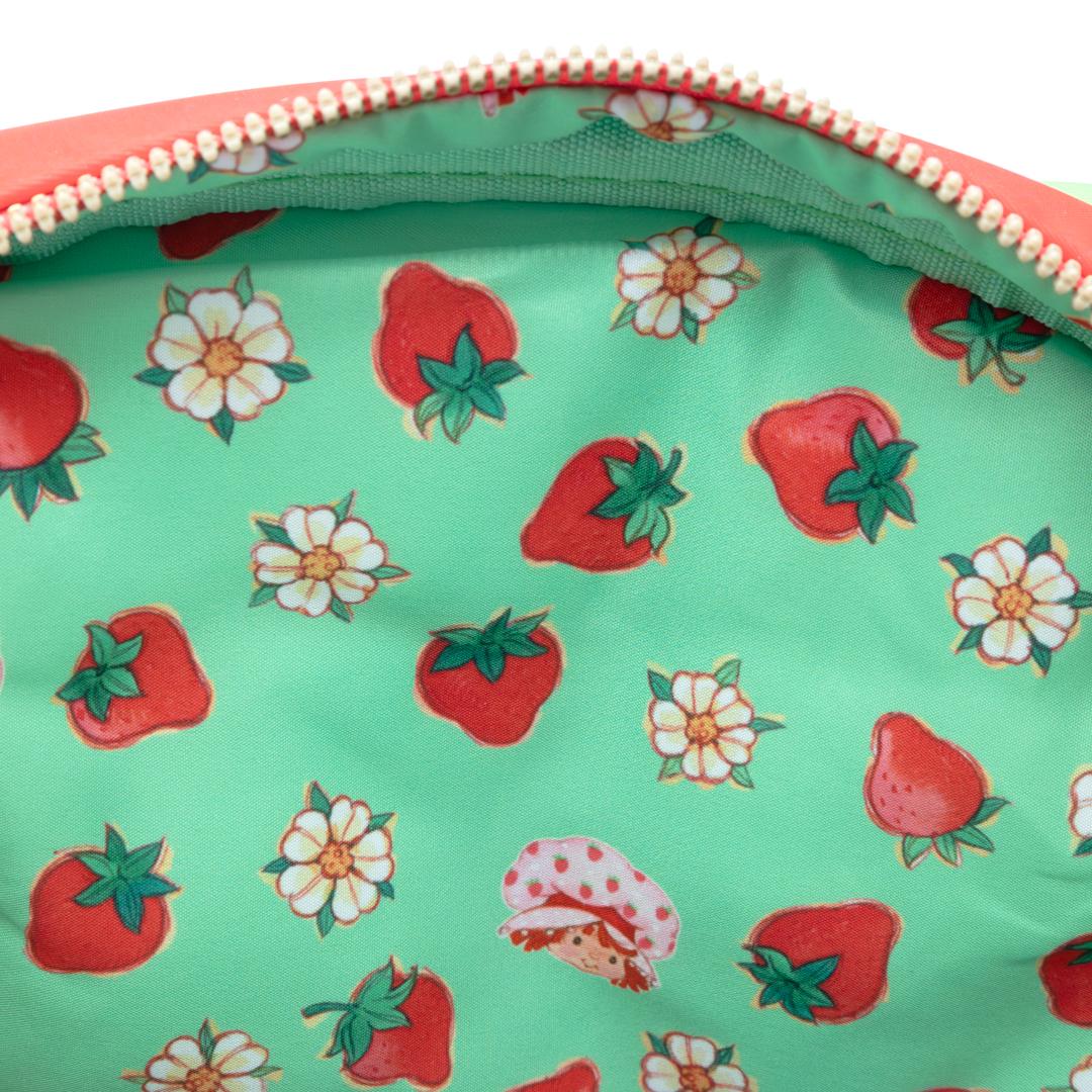 Quilted strawberry crossbody bag with adjustable strap and whimsical printed fabric lining