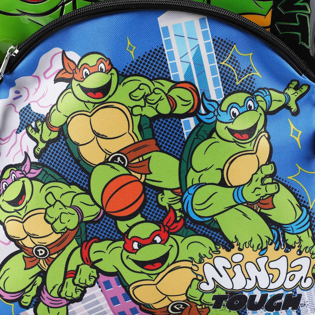 Children's bag with cartoon turtles and 'Ninja Tough' text on a blue background