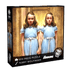 Puzzle box featuring two girls in blue dresses with a wooden door background, &