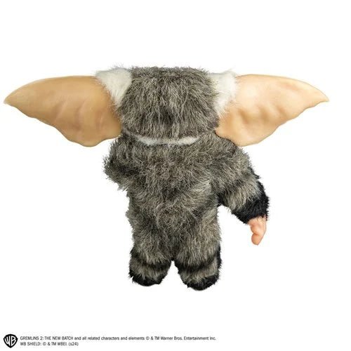 Plush toy resembling a character with large ears on a white background