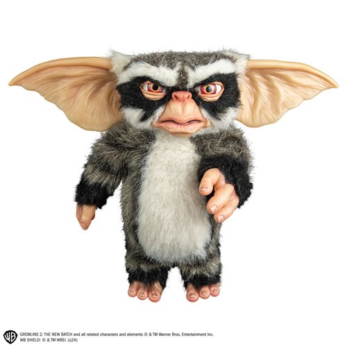 Plush toy resembling a character from Gremlins 2 on a white background
