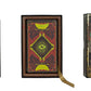 Three books with decorative covers on a white background