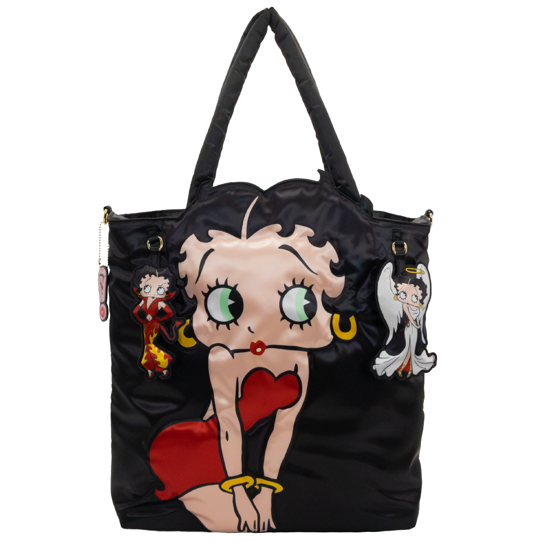 A black nylon tote bag featuring a large Betty Boop character graphic on the front, with two small hanging character charms on the sides, photographed against a plain white background.
