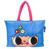 Blue tote bag with cartoon face design and pink handle on a white background