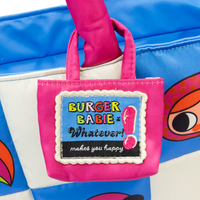 Small pink bag with 'Burger Baby' label held by a hand against a blue background