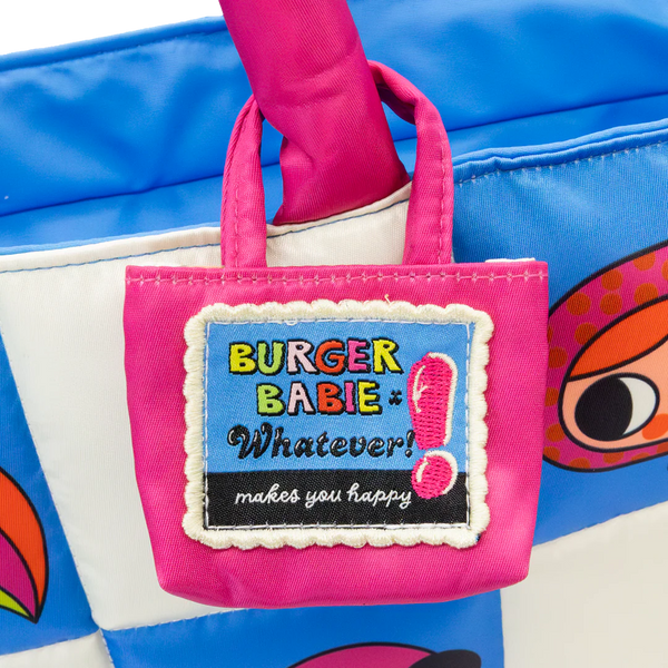 Small pink bag with 'Burger Baby' label held by a hand against a blue background
