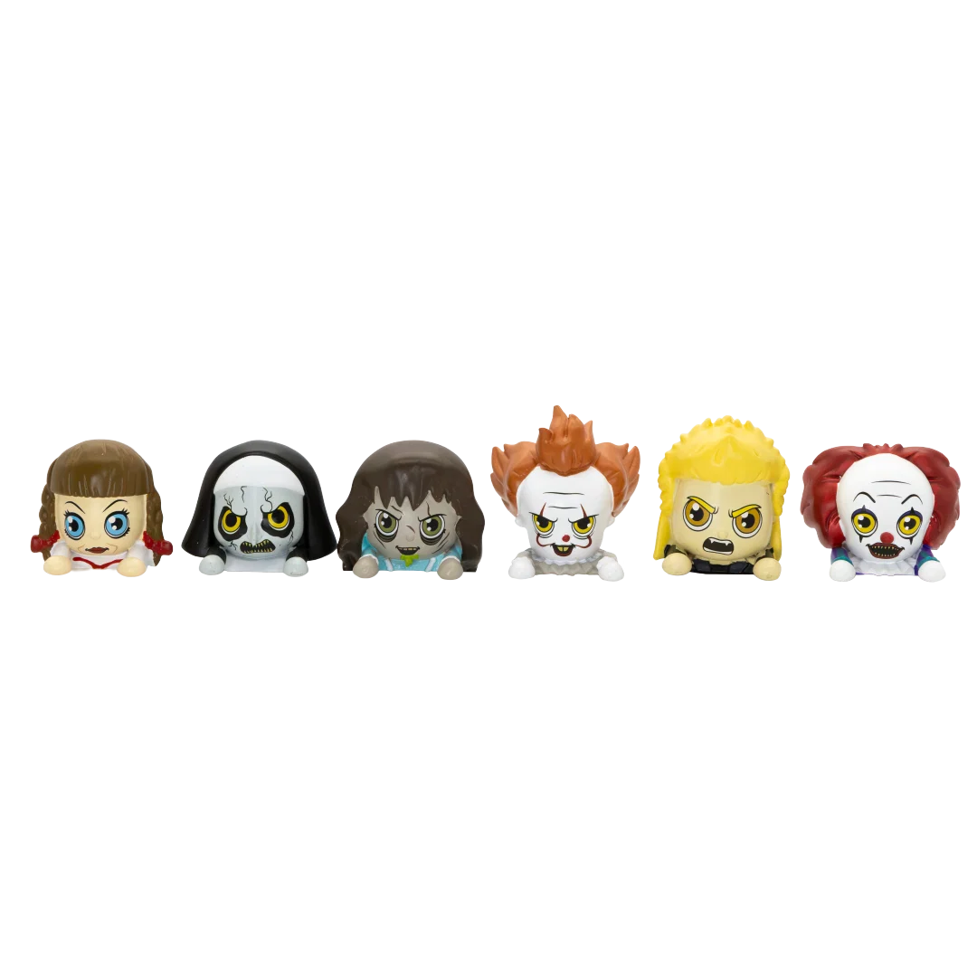 Six small horror-themed character figurines lined up side by side on a plain white background.