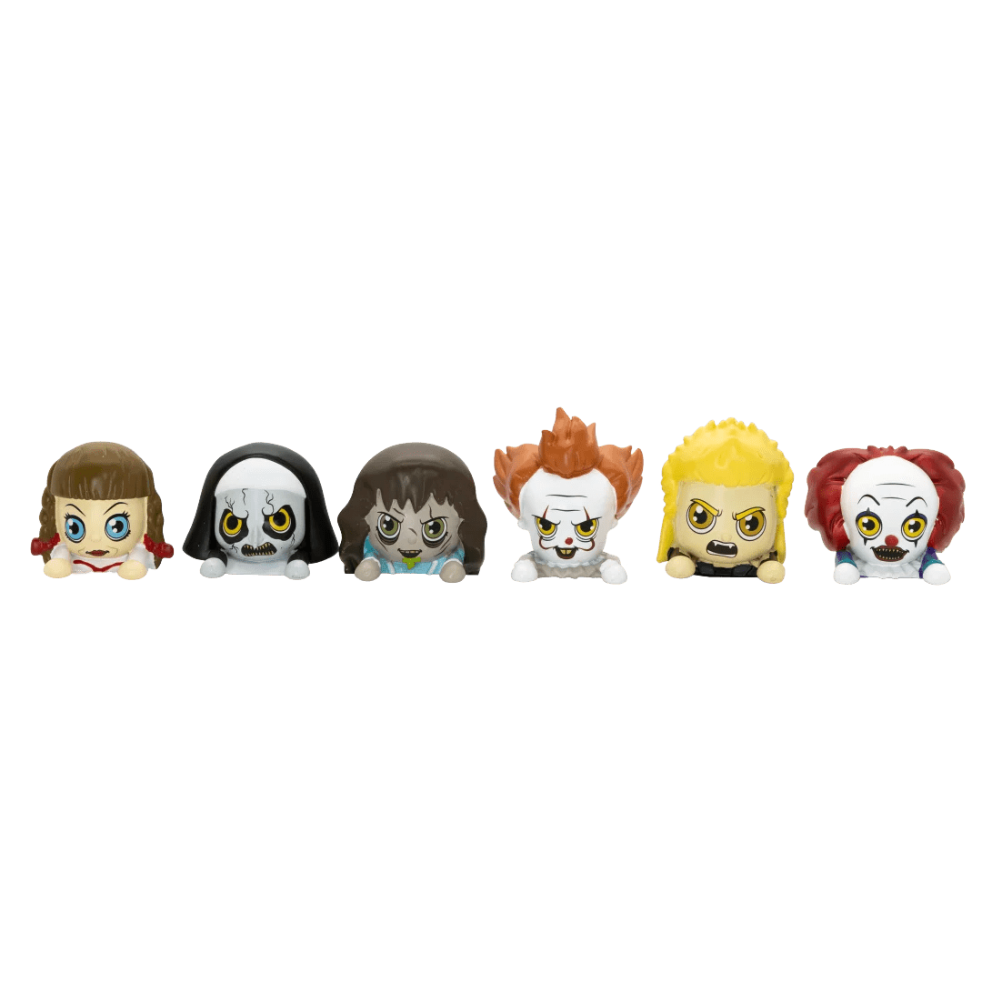 Six small horror-themed character figurines lined up side by side on a plain white background.