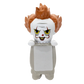 A stylized Pennywise the Clown collectible figure with messy orange hair, a white face, yellow eyes, and a gray body, shown against a plain white background.