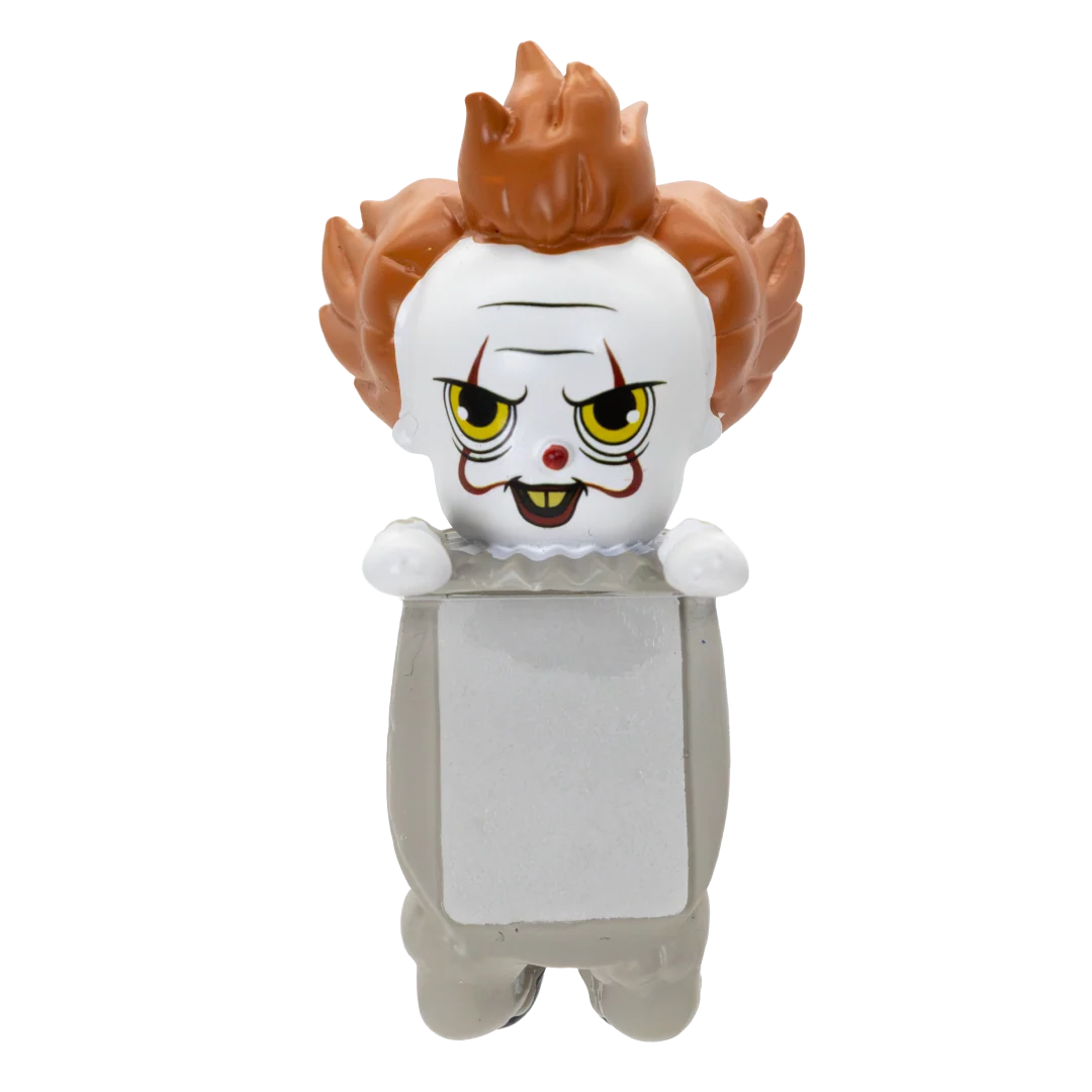 A stylized Pennywise the Clown collectible figure with messy orange hair, a white face, yellow eyes, and a gray body, shown against a plain white background.