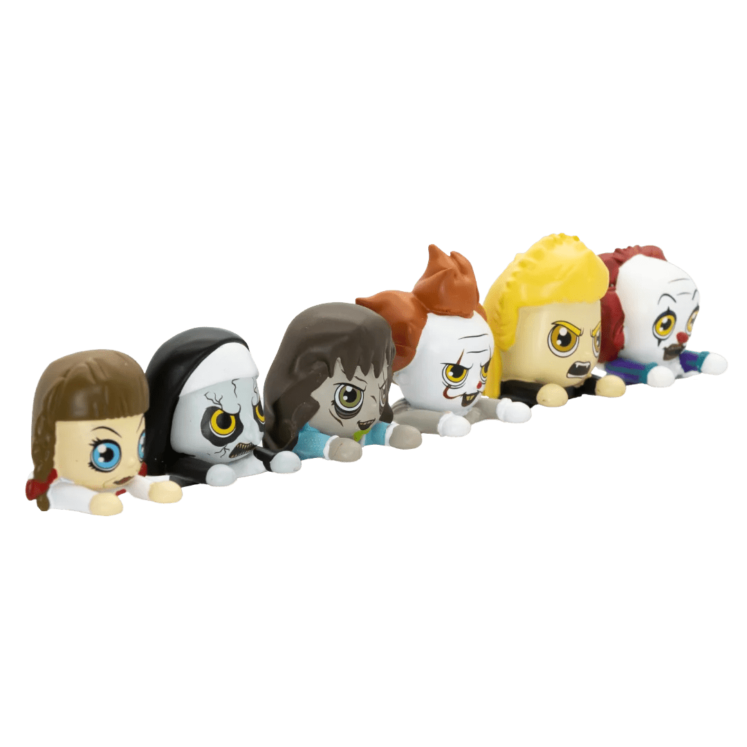 A row of six small stylized character figures with oversized heads and expressive eyes, arranged diagonally on a plain white background. The figures have different hair colors including brown, black, light blue, orange-brown, yellow, and red, and pale skin tones.