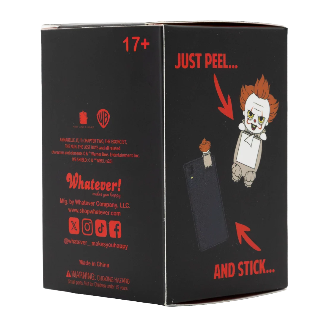 A black product box with red and white text and cartoon illustrations, photographed on a plain white background. The box shows the words 'JUST PEEL.