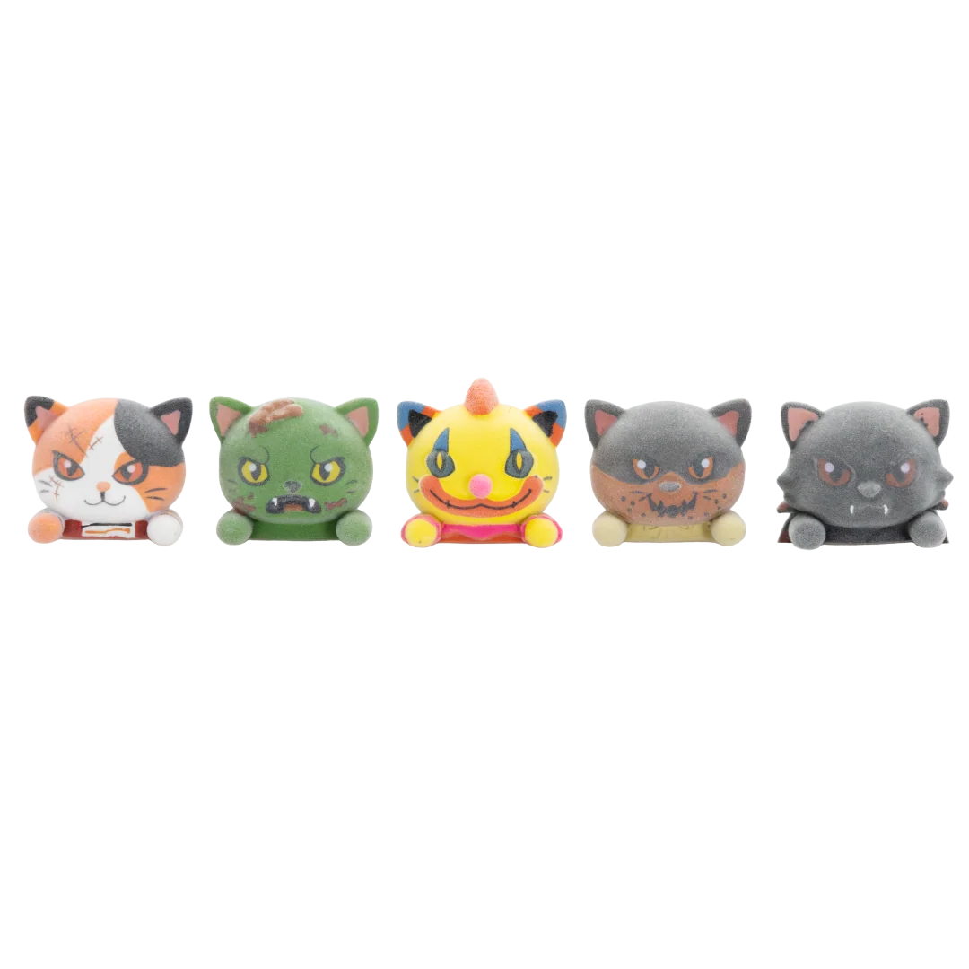 Five small plush cat figures lined up side by side on a plain white background. The cats have distressed, zombie-like or horror-themed painted faces and varied colors: one orange/white/black tri-color cat, one green cat, one yellow cat, one gray cat, and one dark gray cat.