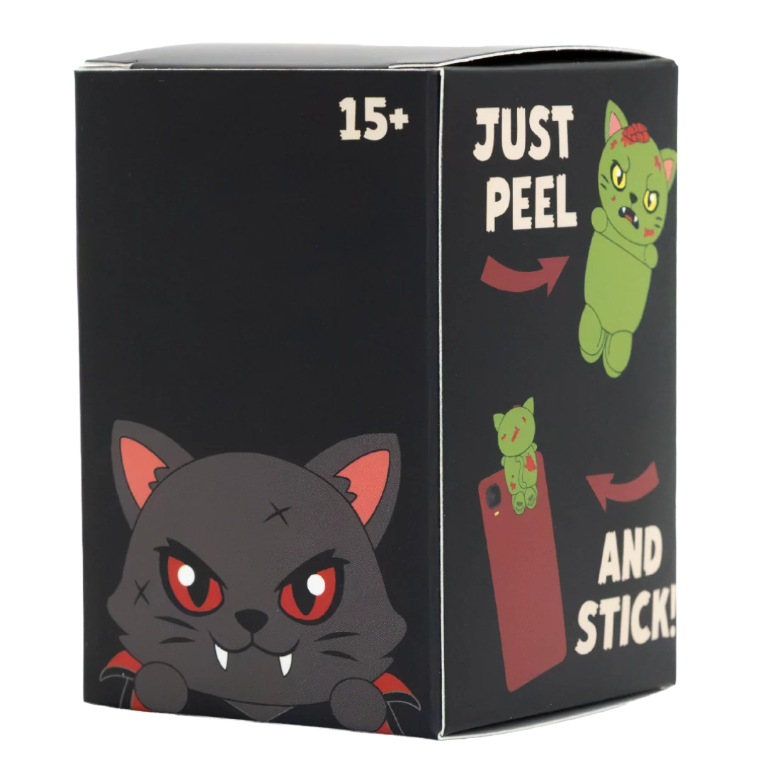 A black product box featuring cartoon vampire cat illustrations and the text '15+' and 'JUST PEEL AND STICK!'.
